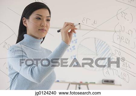 Asian businesswoman writing on white board View Large Photo Image Stock Image - Asian businesswoman writing on white board. Fotosearch