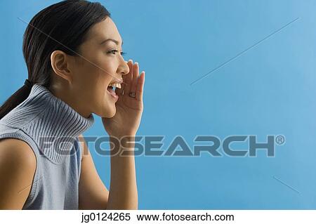 Stock Photography - Asian woman yelling. Fotosearch