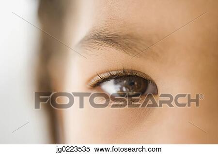 Stock Photography - Close up of African girl’s eye. Fotosearch
