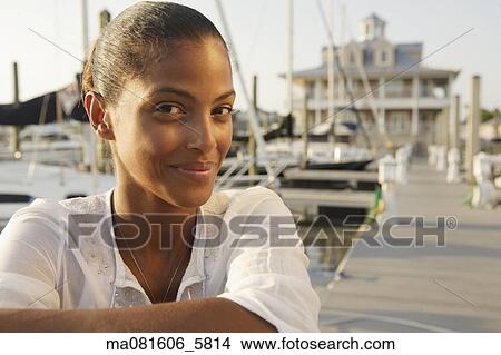 Close up of African woman at marina View Large Photo Image Picture - Close up of African woman at marina. Fotosearch
