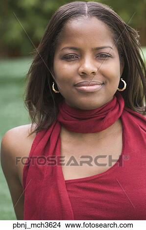 Picture - Close up of African woman outdoors. Fotosearch
