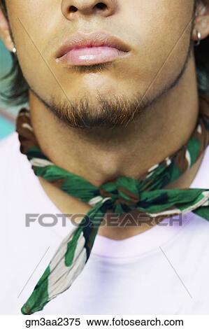 Stock Photography - Close up of bandana around young Hispanic man’s neck. Fotosearch
