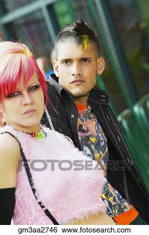 Stock Photograph - Close up of Hispanic punk couple outdoors. Fotosearch