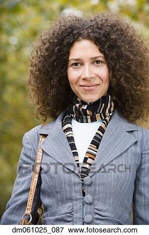 Stock Photo - Close up of Hispanic woman smiling. Fotosearch