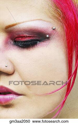 Close up of Hispanic woman with vibrant make-up and facial piercings View Large Photo Image Stock Image - Close up of Hispanic woman with vibrant make-up and facial piercings. Fotosearch