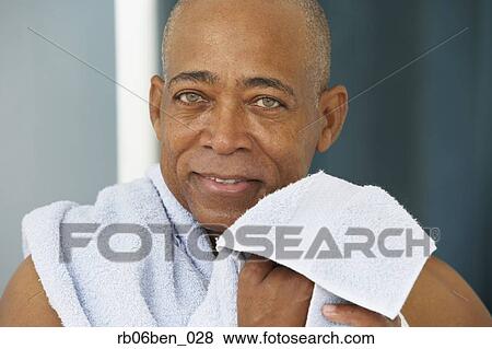 Close up of senior African man with towel View Large Photo Image Stock Photo - Close up of senior African man with towel. Fotosearch