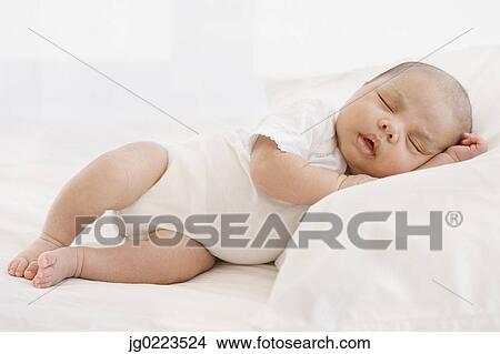 Picture - Close up of sleeping newborn baby. Fotosearch