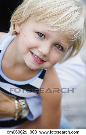 Stock Image - Close up of young girl smiling. Fotosearch