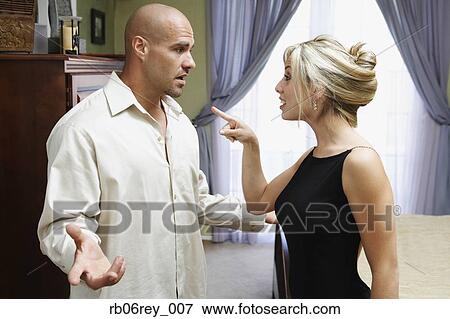 Couple fighting in livingroom View Large Photo Image Stock Photo - Couple fighting in livingroom. Fotosearch