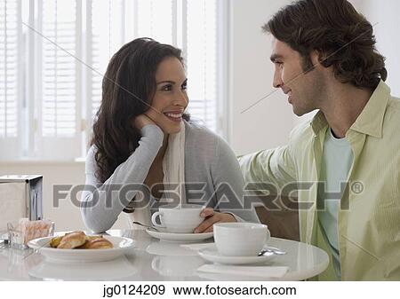 Hispanic couple at breakfast table View Large Photo Image Stock Photo - Hispanic couple at breakfast table. Fotosearch