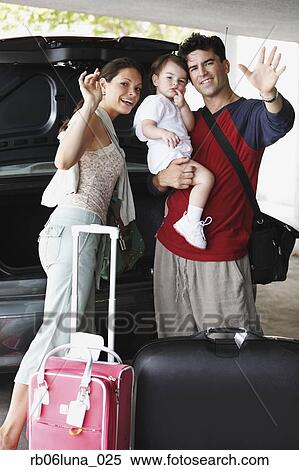 Stock Photography - Hispanic family going on trip and waving. Fotosearch