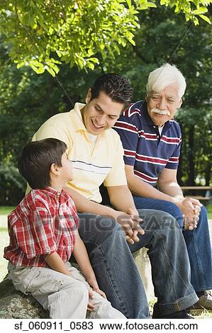 Hispanic grandfather, father and son sitting together View Large Photo Image Stock Image - Hispanic grandfather, father and son sitting together. Fotosearch