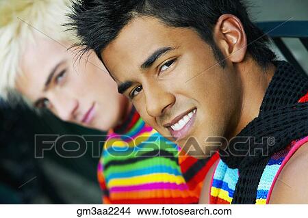Hispanic teenage boy with friend in background View Large Photo Image Picture - Hispanic teenage boy with friend in background. Fotosearch