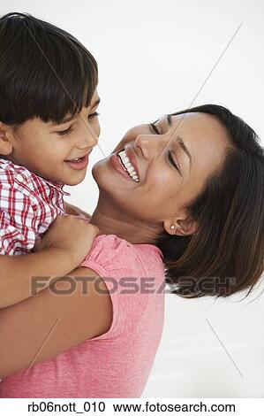 Indian mother and son hugging View Large Photo Image Stock Image - Indian mother and son hugging. Fotosearch