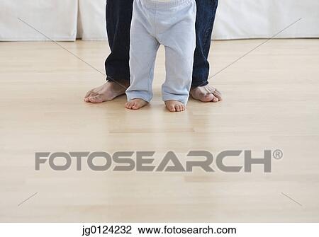 Low section of barefoot baby and father View Large Photo Image Stock Image - Low section of barefoot baby and father. Fotosearch