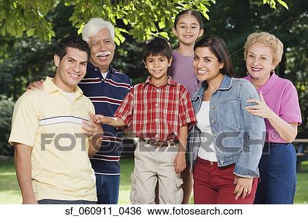 Multi-generational Hispanic family smiling in park View Large Photo Image Stock Photograph - Multi-generational Hispanic family smiling in park. Fotosearch