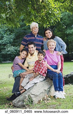 Multi-generational Hispanic family smiling in park View Large Photo Image Stock Photography - Multi-generational Hispanic family smiling in park. Fotosearch