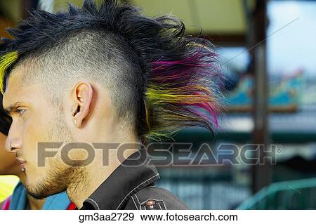 Profile of Hispanic male punk with mohawk hairstyle outdoors View Large Photo Image Stock Photo - Profile of Hispanic male punk with mohawk hairstyle outdoors. Fotosearch
