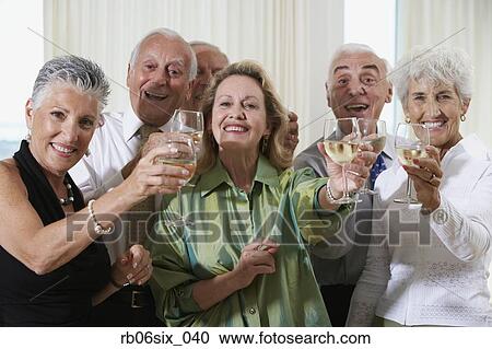 Senior couples toasting at party View Large Photo Image Stock Image - Senior couples toasting at party. Fotosearch