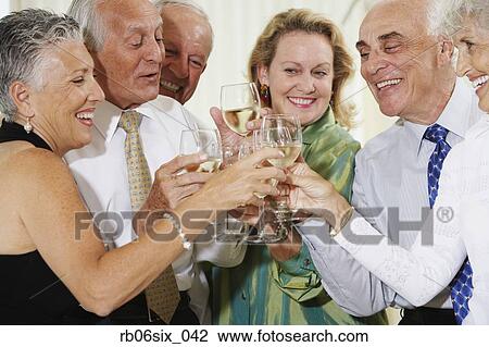 Senior couples toasting at party View Large Photo Image Stock Photo - Senior couples toasting at party. Fotosearch - Search Stock Photography, Print Pictures, Images, and Photo Clip Art