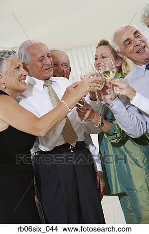 Senior couples toasting at party View Large Photo Image Stock Photo - Senior couples toasting at party. Fotosearch - Search Stock Images, Mural Photographs, Pictures, and Clipart Photos