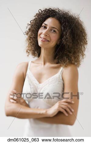 Stock Image - Studio shot of Hispanic woman wearing slip. Fotosearch