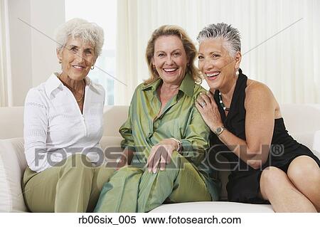 Three senior women sitting on sofa View Large Photo Image Stock Photography - Three senior women sitting on sofa. Fotosearch