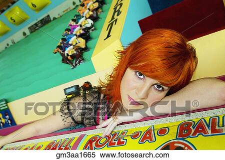 Young Hispanic woman leaning carnival game View Large Photo Image Stock Photography - Young Hispanic woman leaning carnival game. Fotosearch