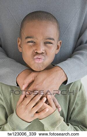 African boy blowing kiss View Large Photo Image Stock Photo - African boy blowing kiss. Fotosearch