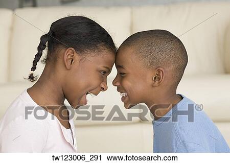African brother and sister butting heads View Large Photo Image Stock Image - African brother and sister butting heads. Fotosearch