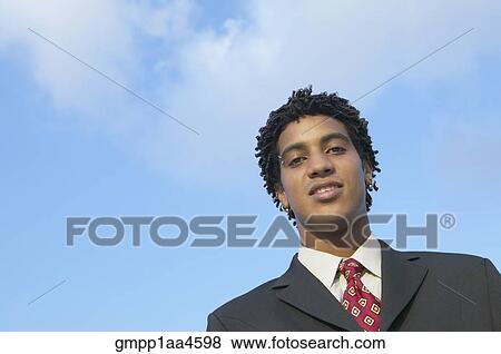 African businessman under blue sky View Large Photo Image Stock Photo - African businessman under blue sky. Fotosearch