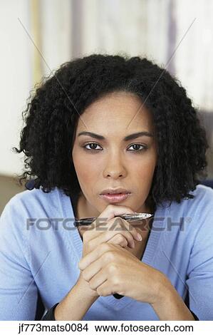 African businesswoman holding pen View Large Photo Image Picture - African businesswoman holding pen. Fotosearch
