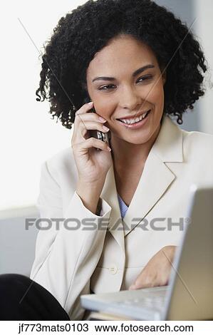 African businesswoman talking on cell phone View Large Photo Image Stock Image - African businesswoman talking on cell phone. Fotosearch