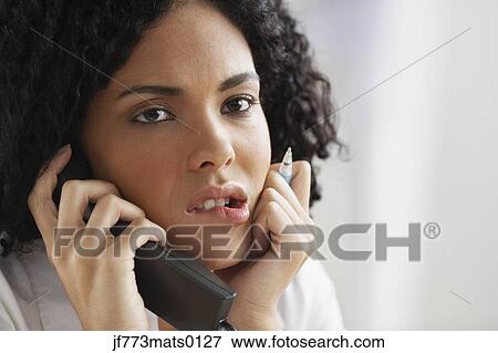 African businesswoman talking on telephone View Large Photo Image Stock Photo - African businesswoman talking on telephone. Fotosearch