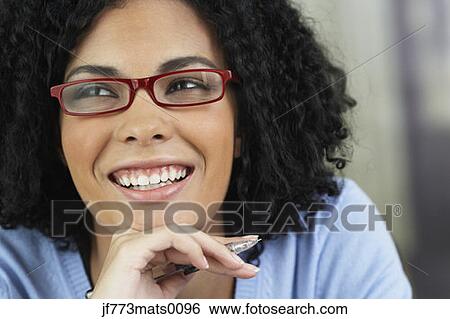 Stock Photograph - African businesswoman wearing eyeglasses. Fotosearch