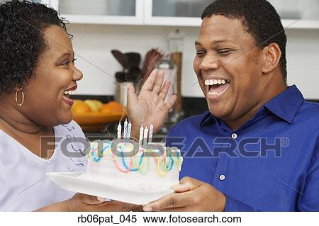 Stock Photography - African couple celebrating birthday. Fotosearch