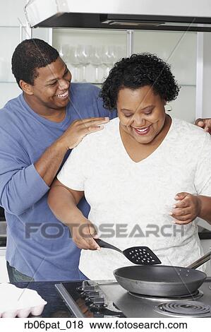 African couple cooking in kitchen View Large Photo Image Stock Photo - African couple cooking in kitchen. Fotosearch