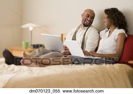 African couple laughing in bed View Large Photo Image Stock Photography - African couple laughing in bed. Fotosearch