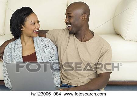 African couple smiling at each other View Large Photo Image Picture - African couple smiling at each other. Fotosearch
