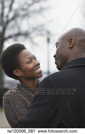 African couple smiling at each other View Large Photo Image Stock Photo - African couple smiling at each other. Fotosearch