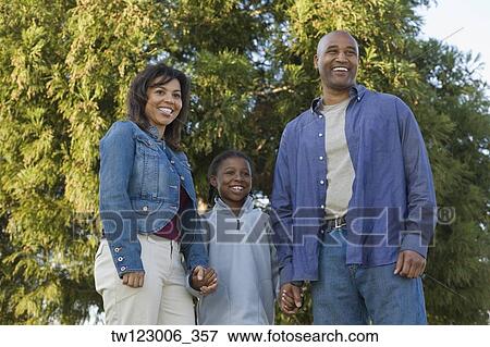 African family holding hands at park View Large Photo Image Stock Photo - African family holding hands at park. Fotosearch