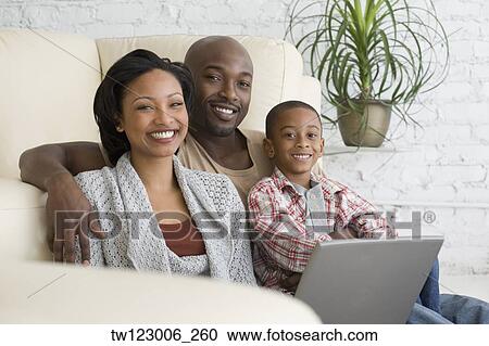 African family hugging on sofa View Large Photo Image Stock Image - African family hugging on sofa. Fotosearch