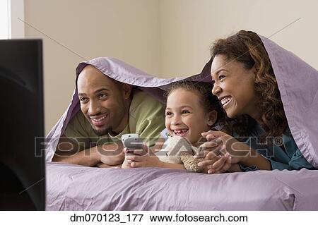 African family watching television View Large Photo Image Stock Photo - African family watching television. Fotosearch