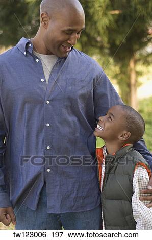 Stock Photo - African father and son smiling at each other. Fotosearch