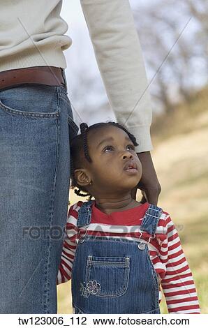 African girl standing next to father View Large Photo Image Stock Image - African girl standing next to father. Fotosearch