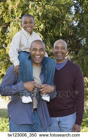African grandfather, father and son in park View Large Photo Image Stock Image - African grandfather, father and son in park. Fotosearch