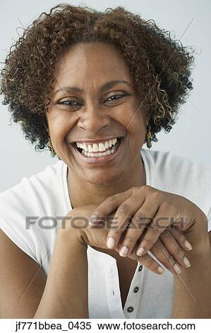 Stock Photography - African woman laughing. Fotosearch