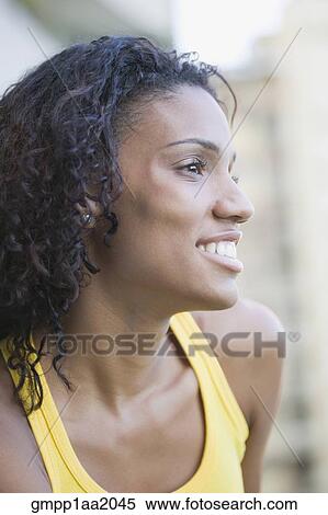 Stock Photography - African woman looking to side. Fotosearch
