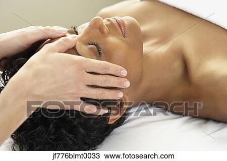 African woman receiving facial massage View Large Photo Image Stock Image - African woman receiving facial massage. Fotosearch
