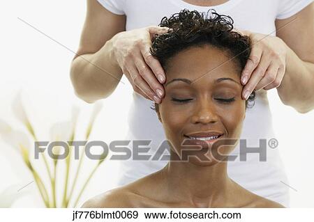 African woman receiving facial massage View Large Photo Image Stock Photo - African woman receiving facial massage. Fotosearch